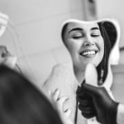 Woman Smiling in Dental Office